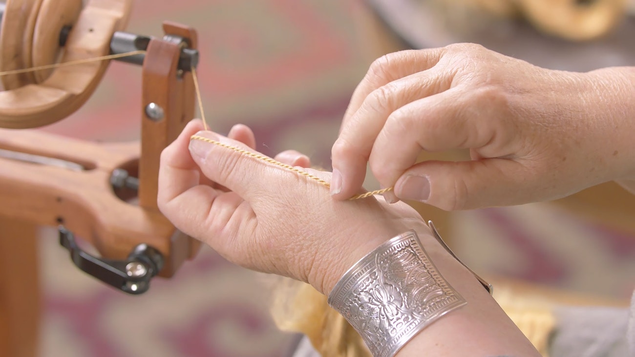 Judith Showing Red Eri in a Classic Two-Ply Yarn