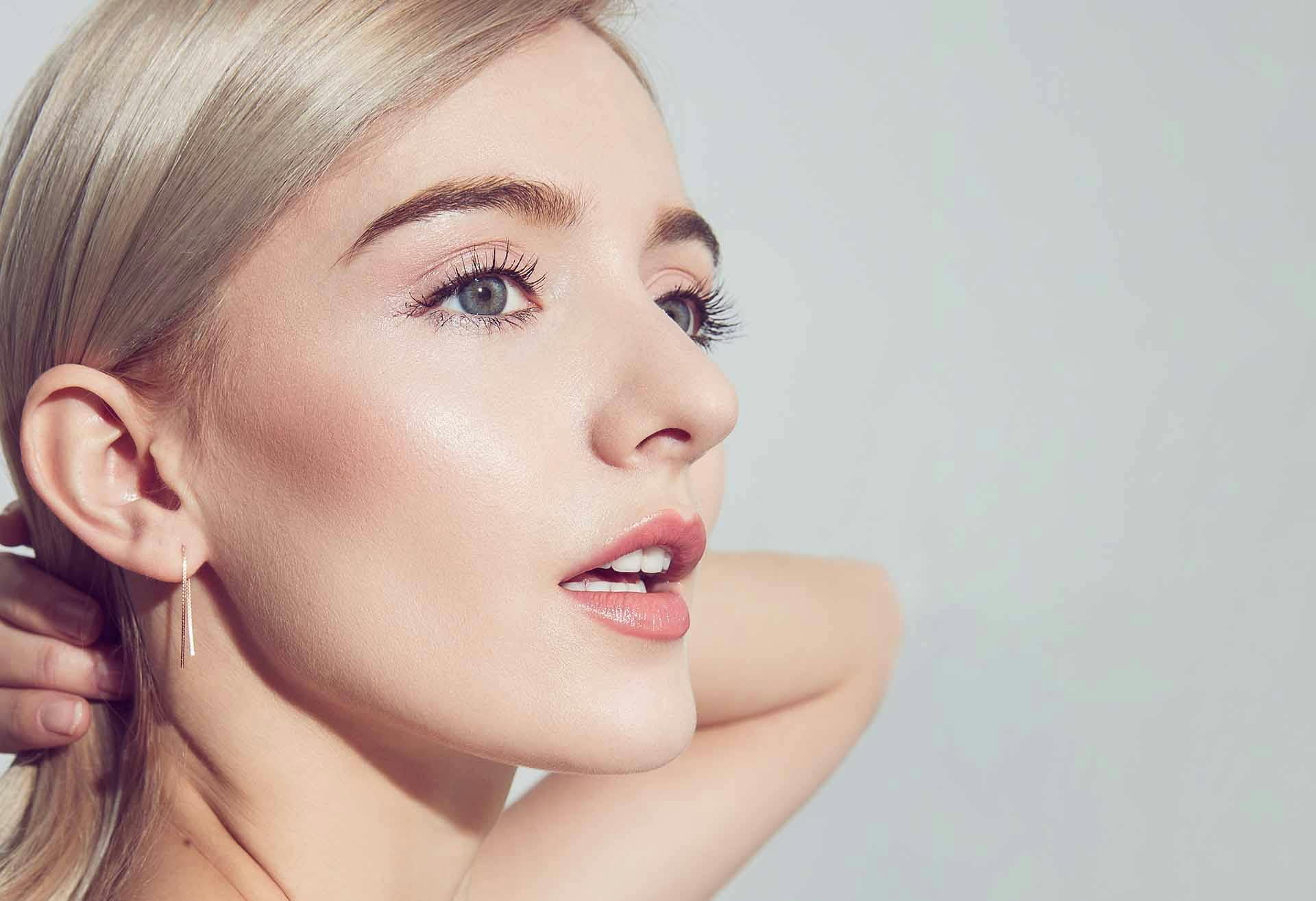 Woman with make-up on and hair back