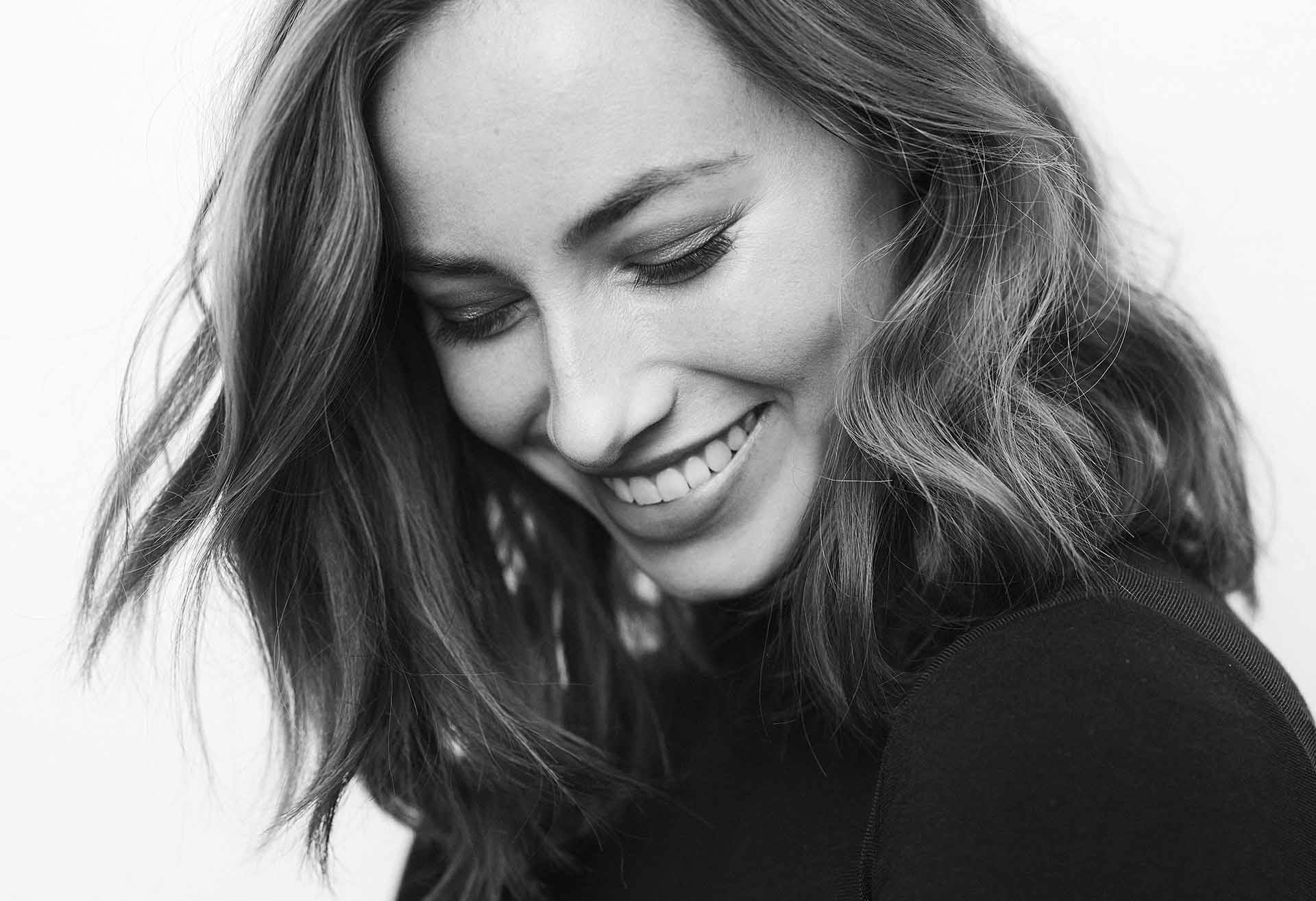 Woman smiling and looking down