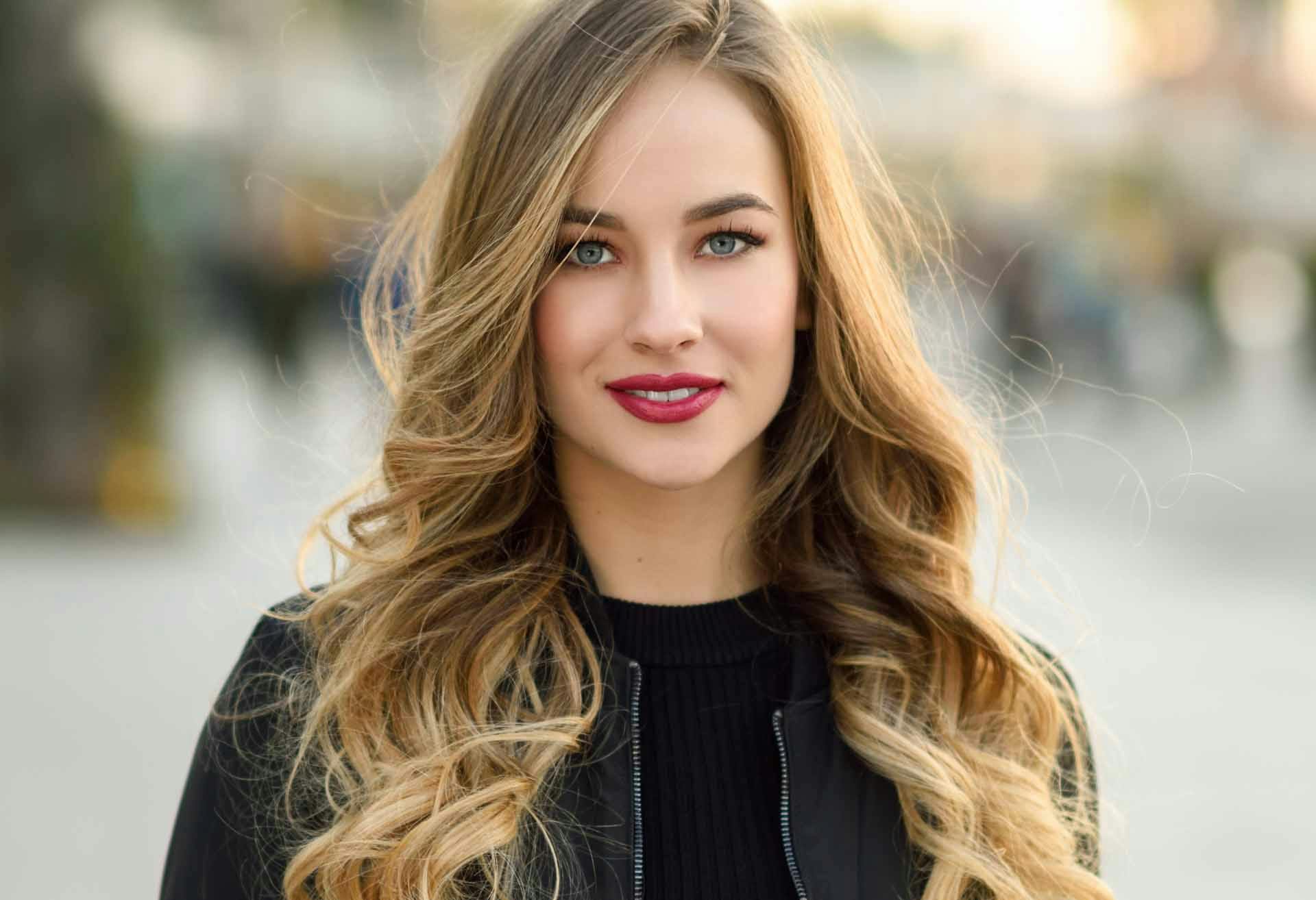 Smiling woman with red lipstick
