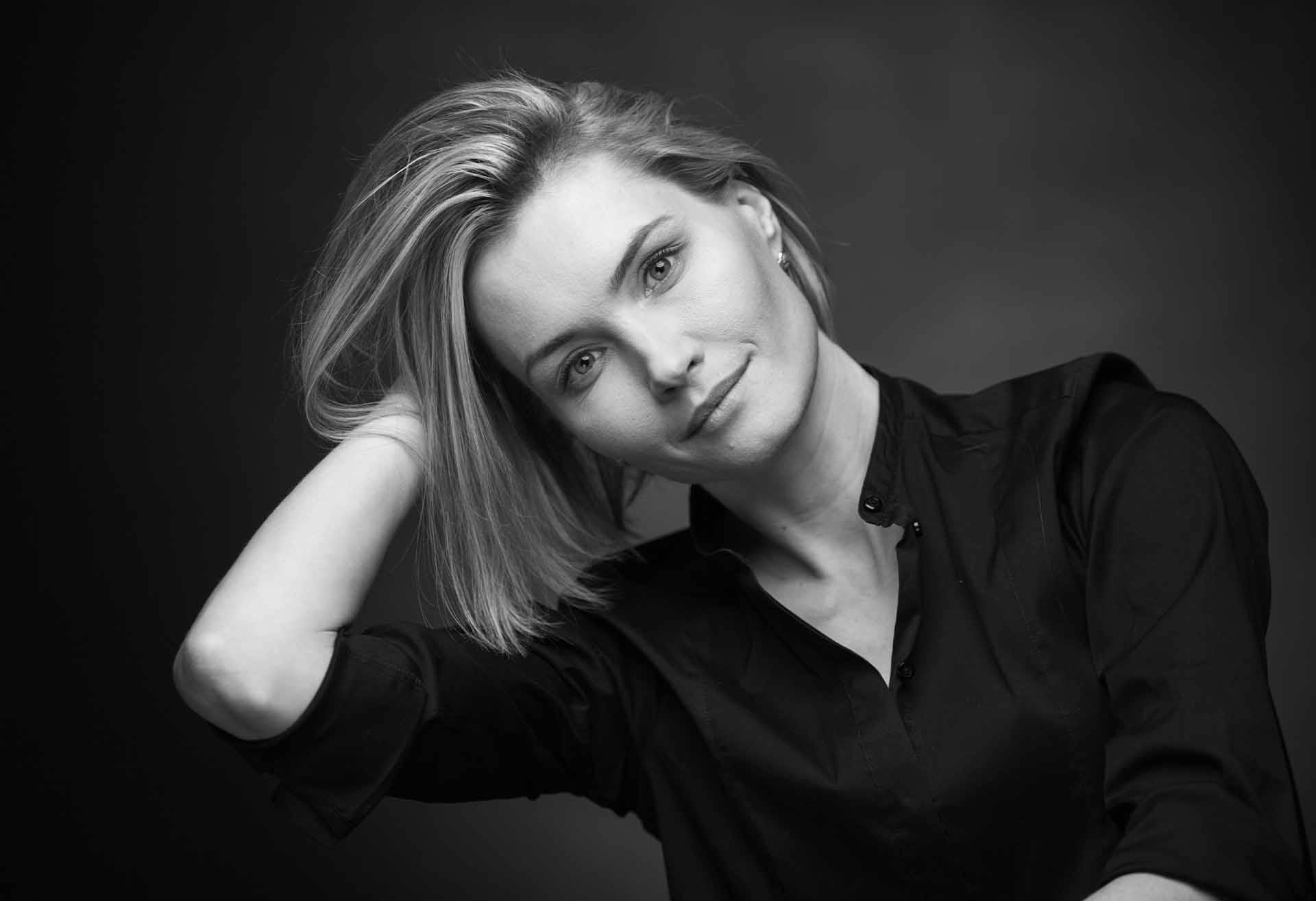 Black and white photo of a woman with short, straight hair
