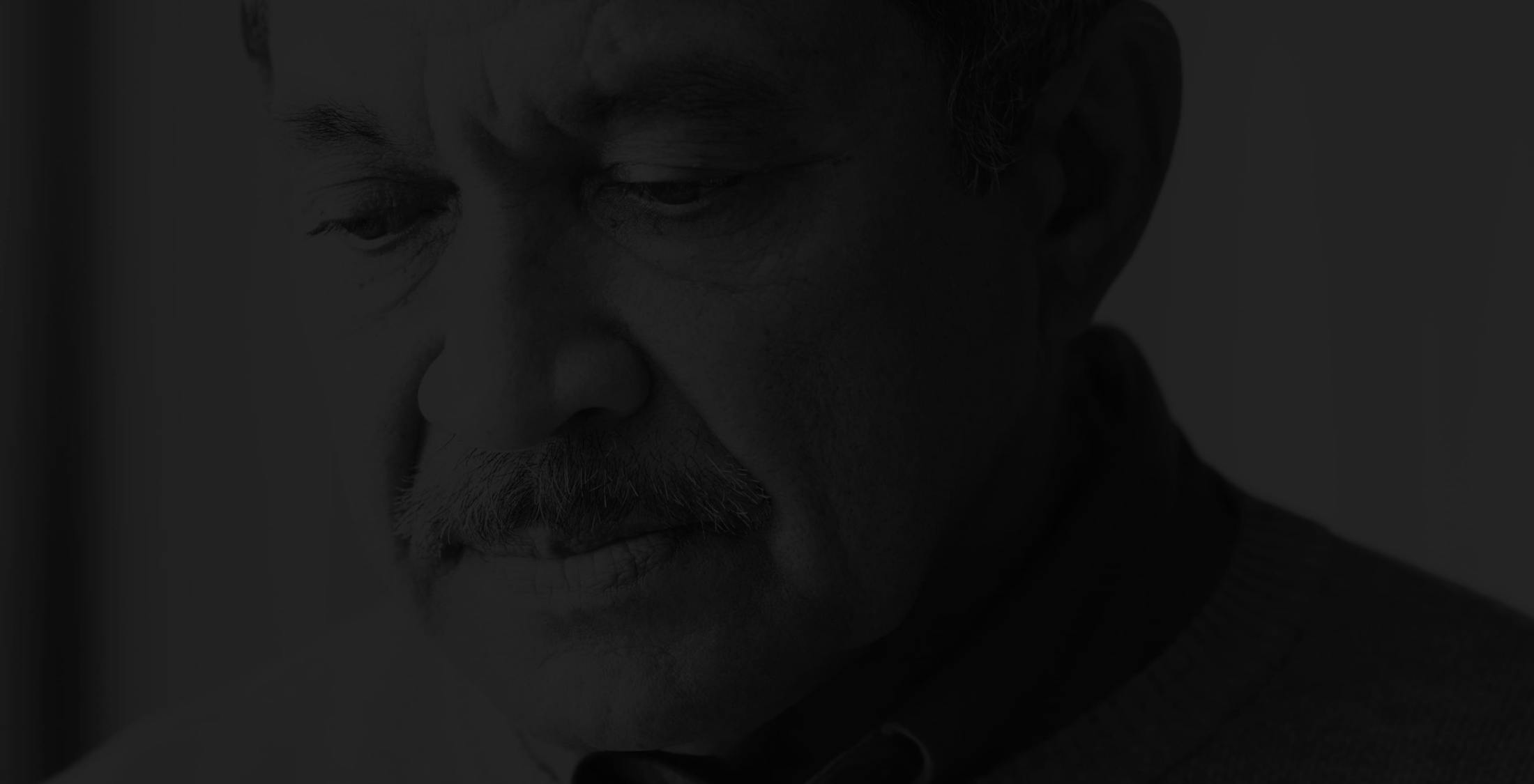 Darkened image of a man's face