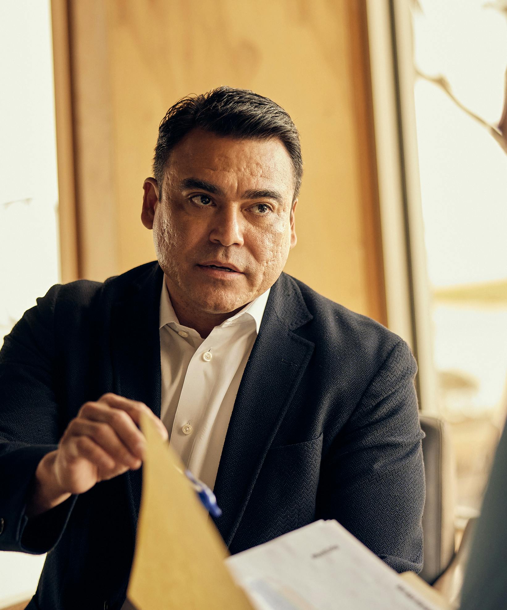 Attorney Espinoza speaking with a client