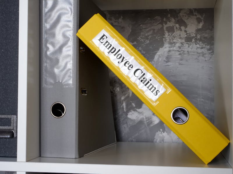 Employee claims folder on shelf