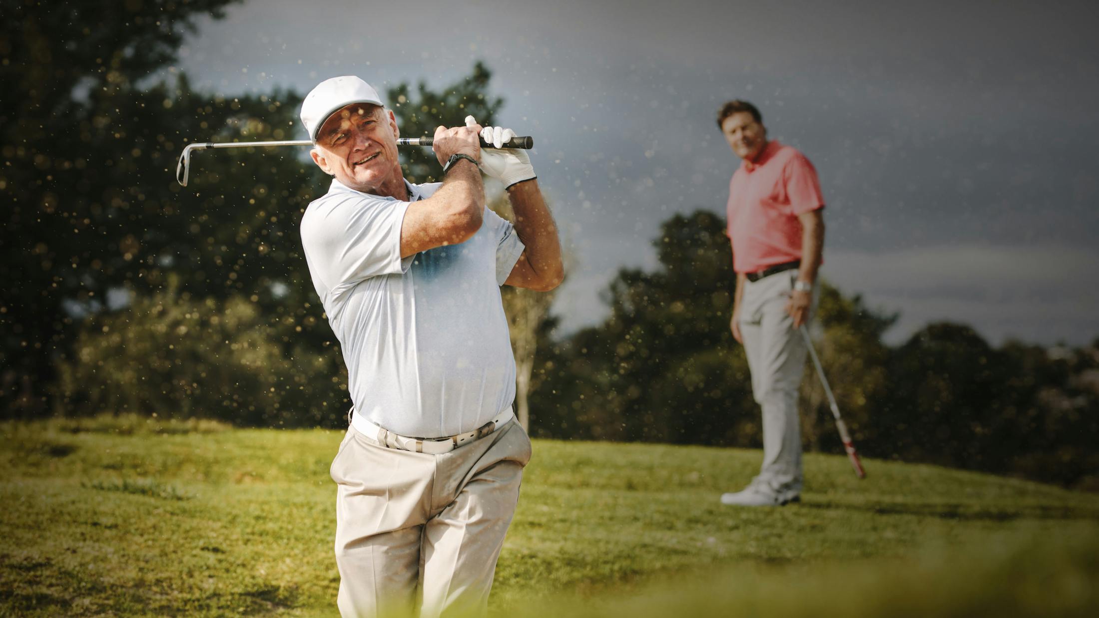 Two older men golfing post seeing Cardiologist.