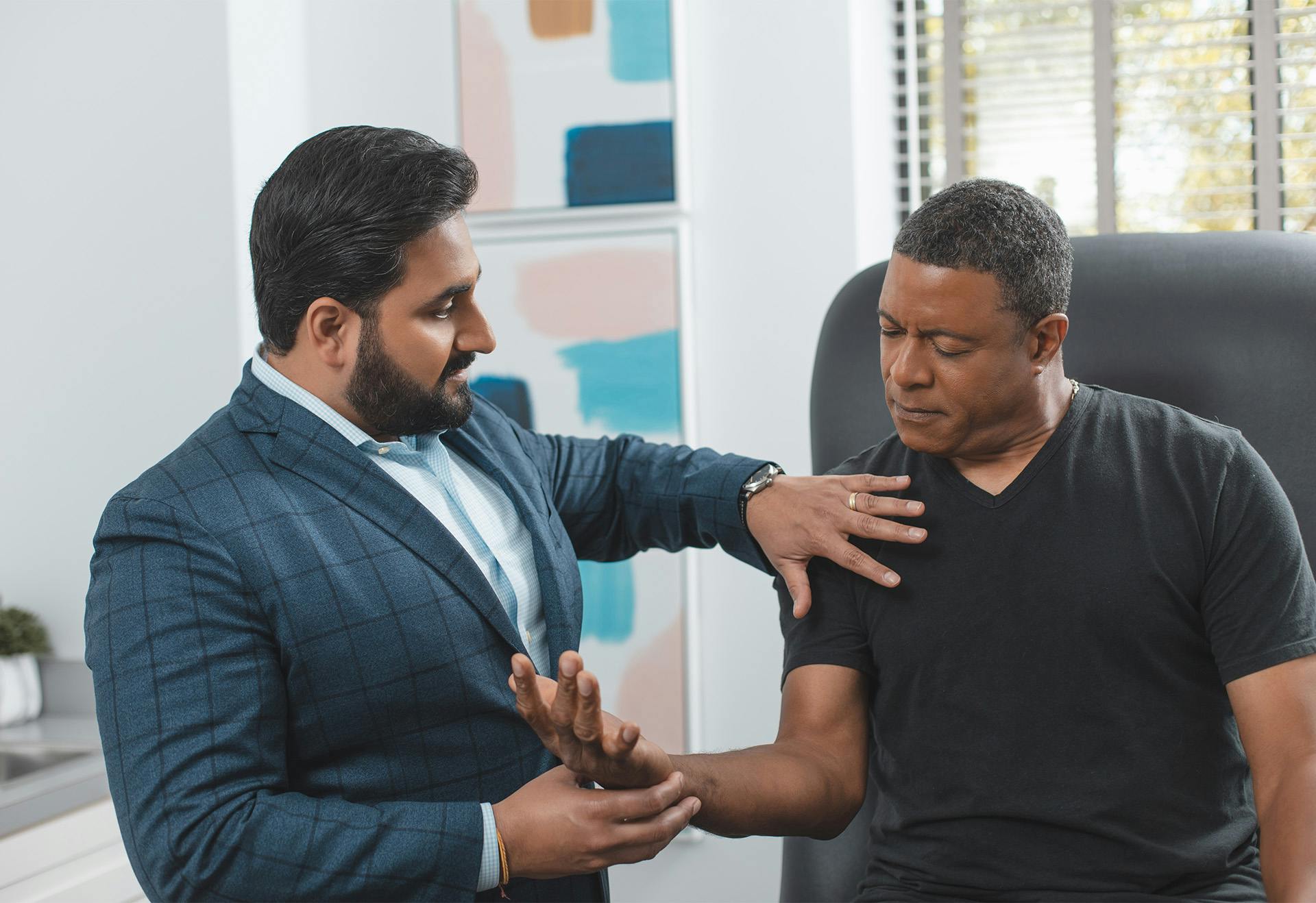 Dr. Sharma interviewing a patient.