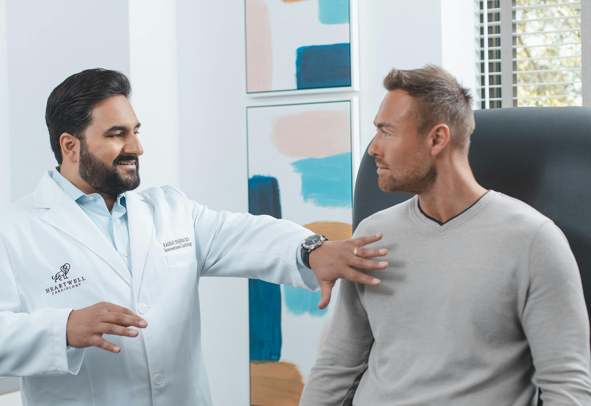 Dr. Sharma performing a cardiac consultation.