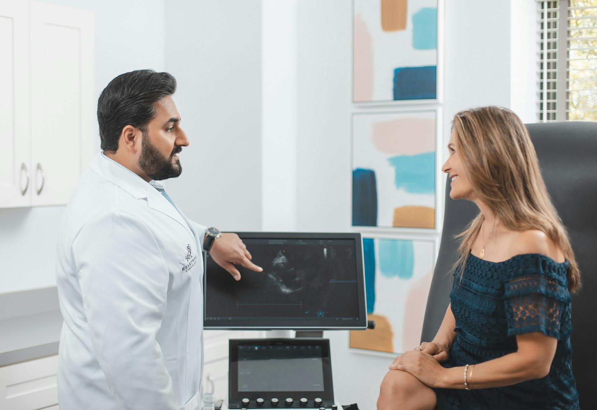 Doctor Sharma Showing a Patient a Diagnostic