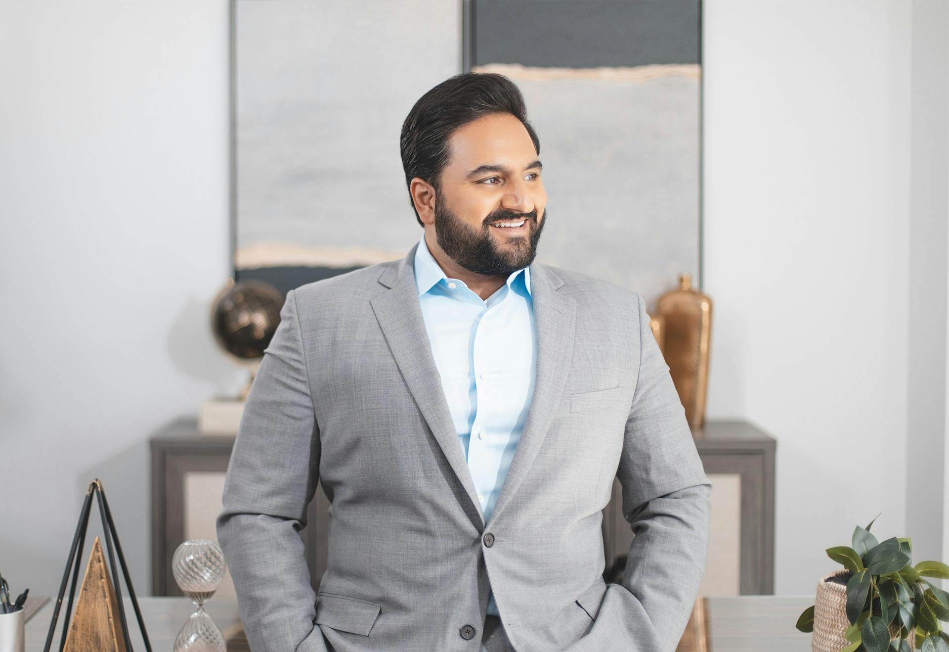 Doctor Sharma with Light Blue Shirt and Grey Suit