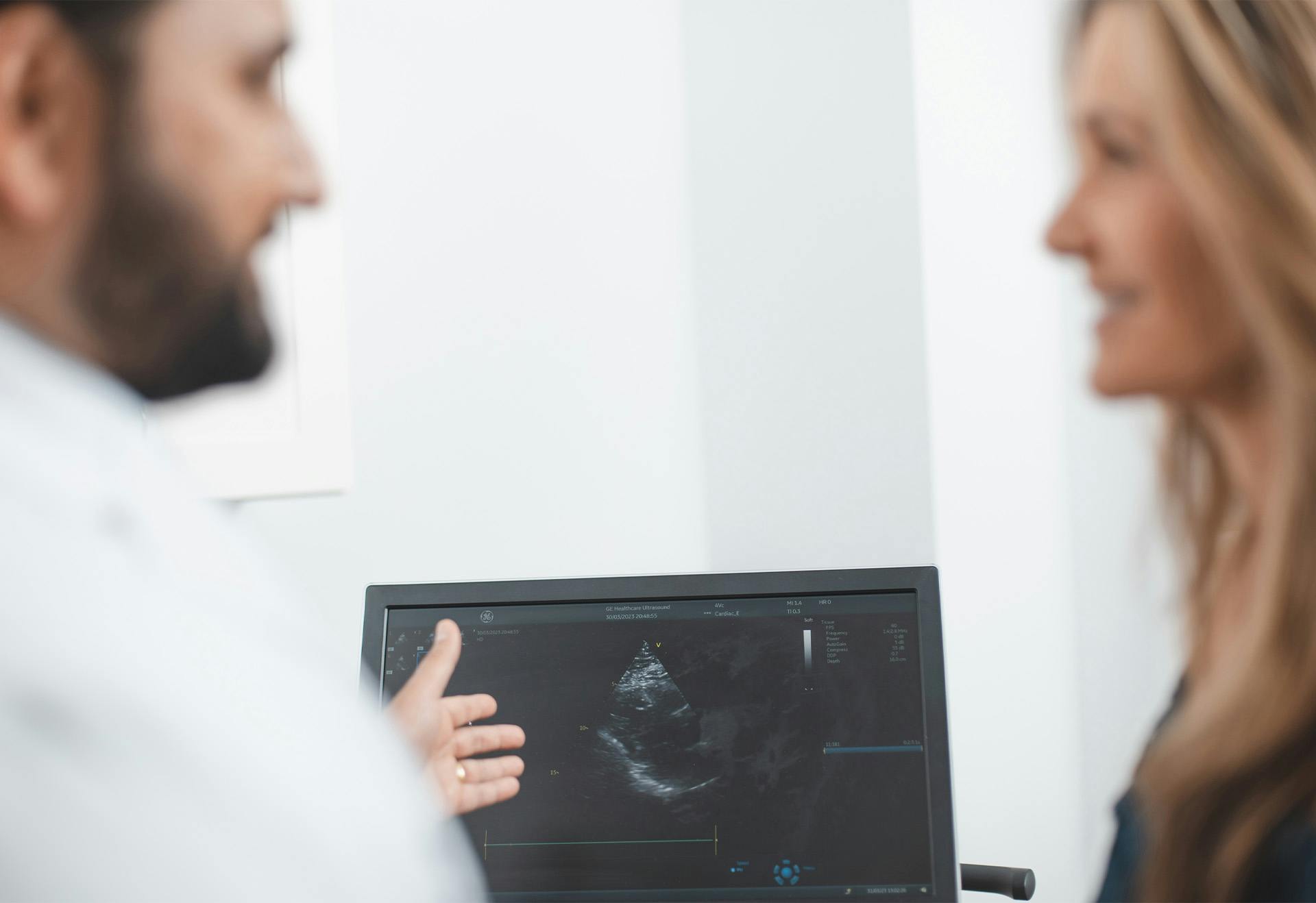 Doctor showing Patient Echocardiogram