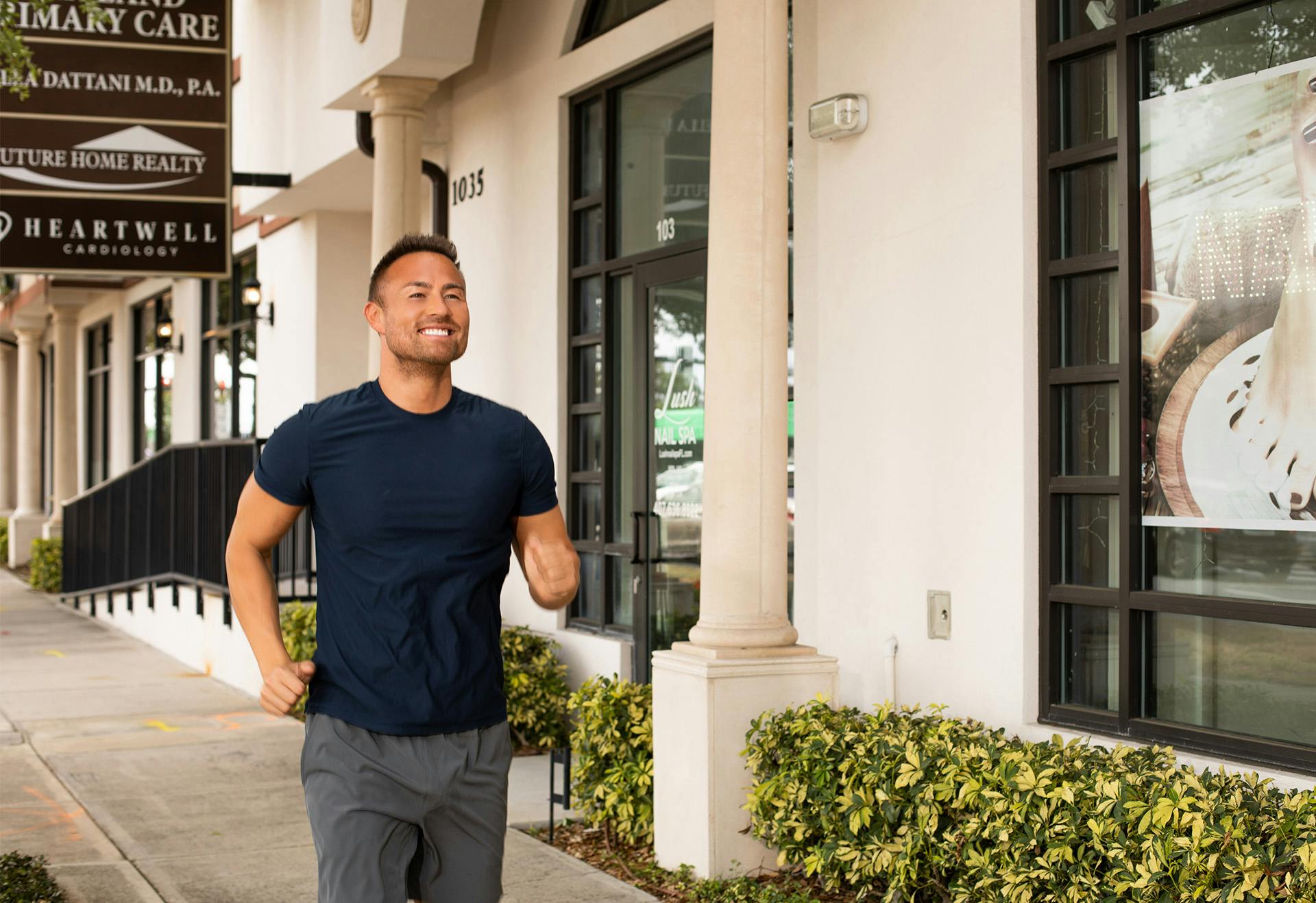 Man jogging on the sidewalk.