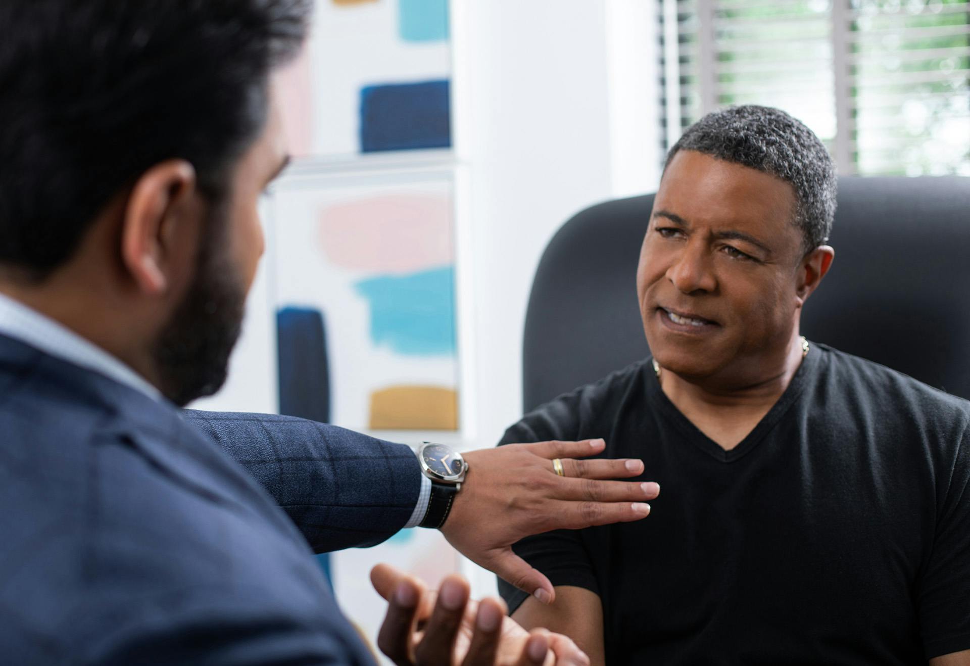 Doctor Sharma Speaking with a Male Patient