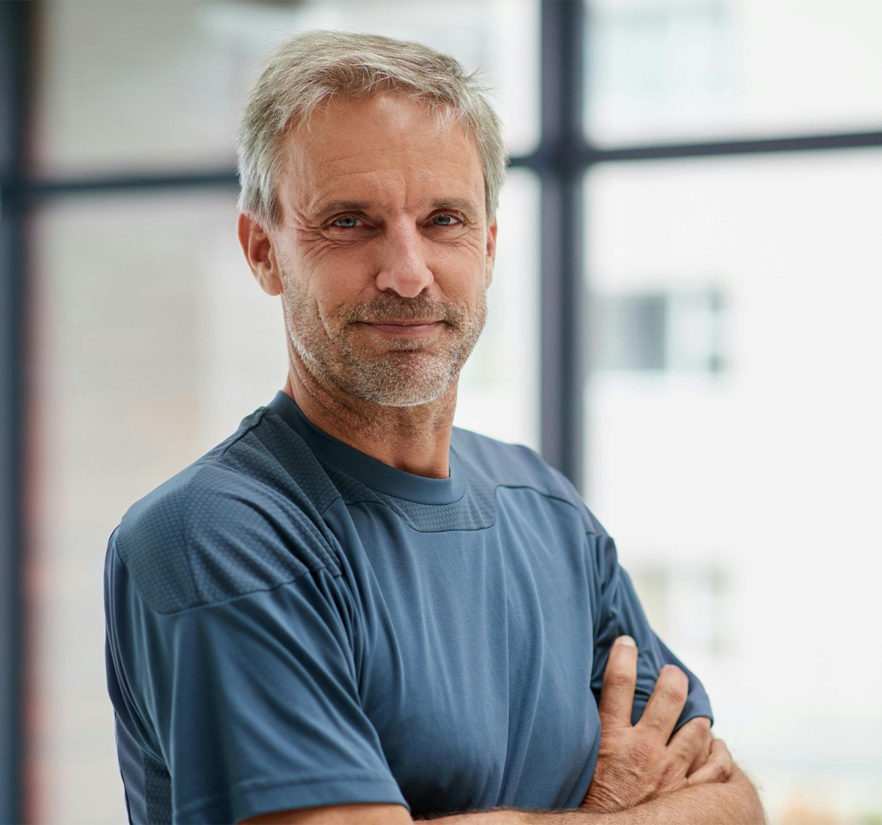 Older man crossing his arms