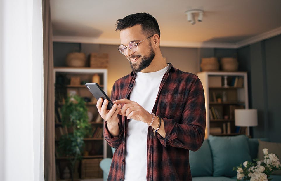 Man scrolling through phone