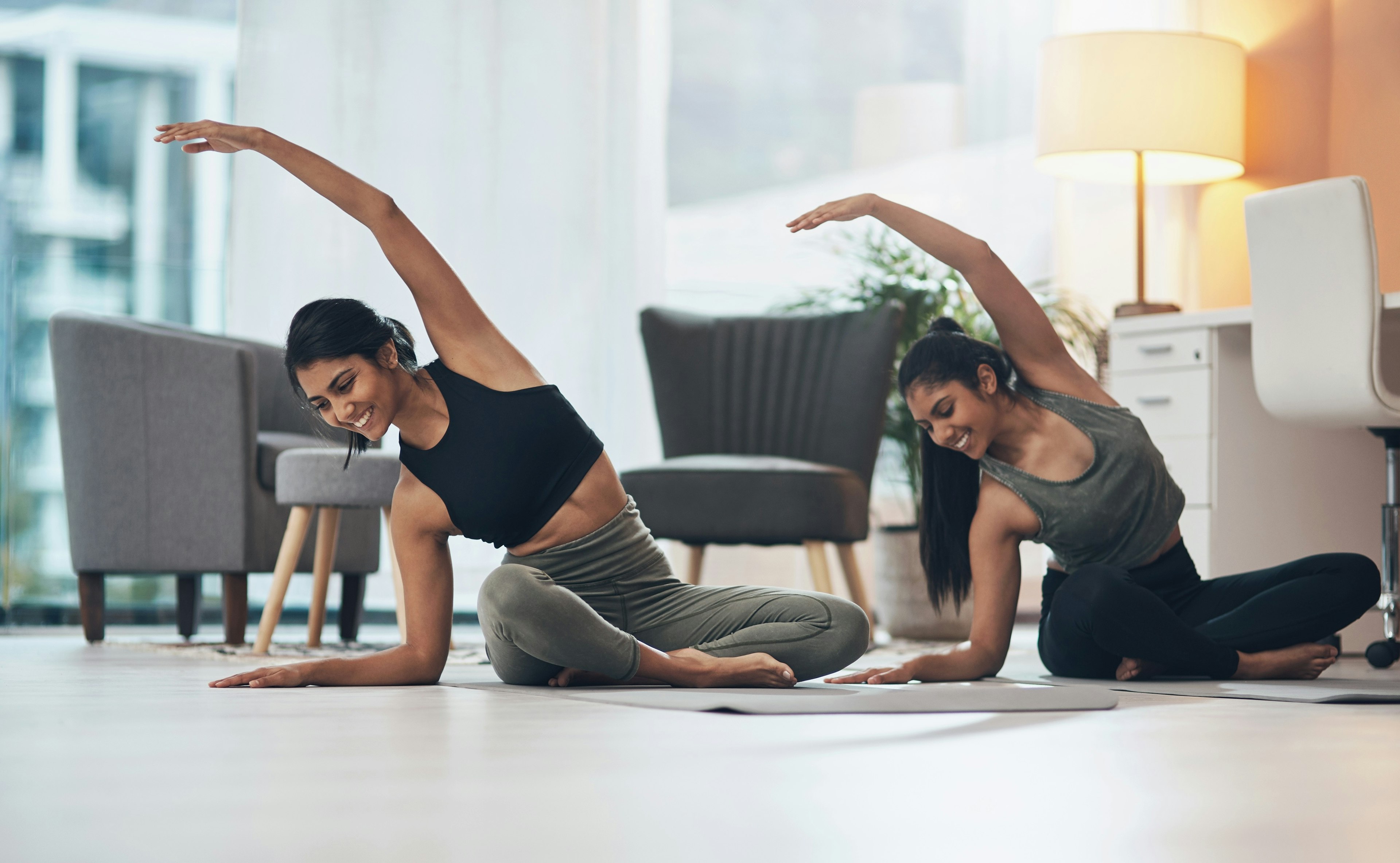 Two girls stretching