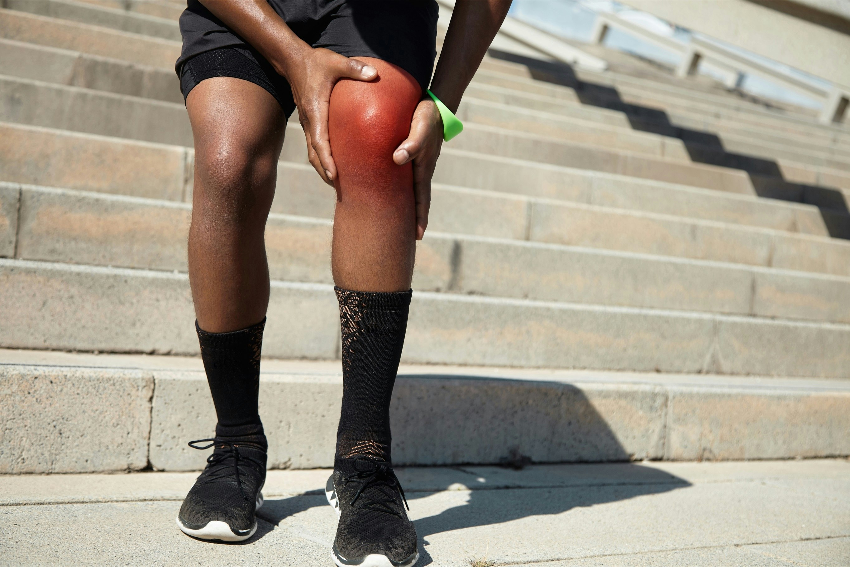 Man holding Injured Knee