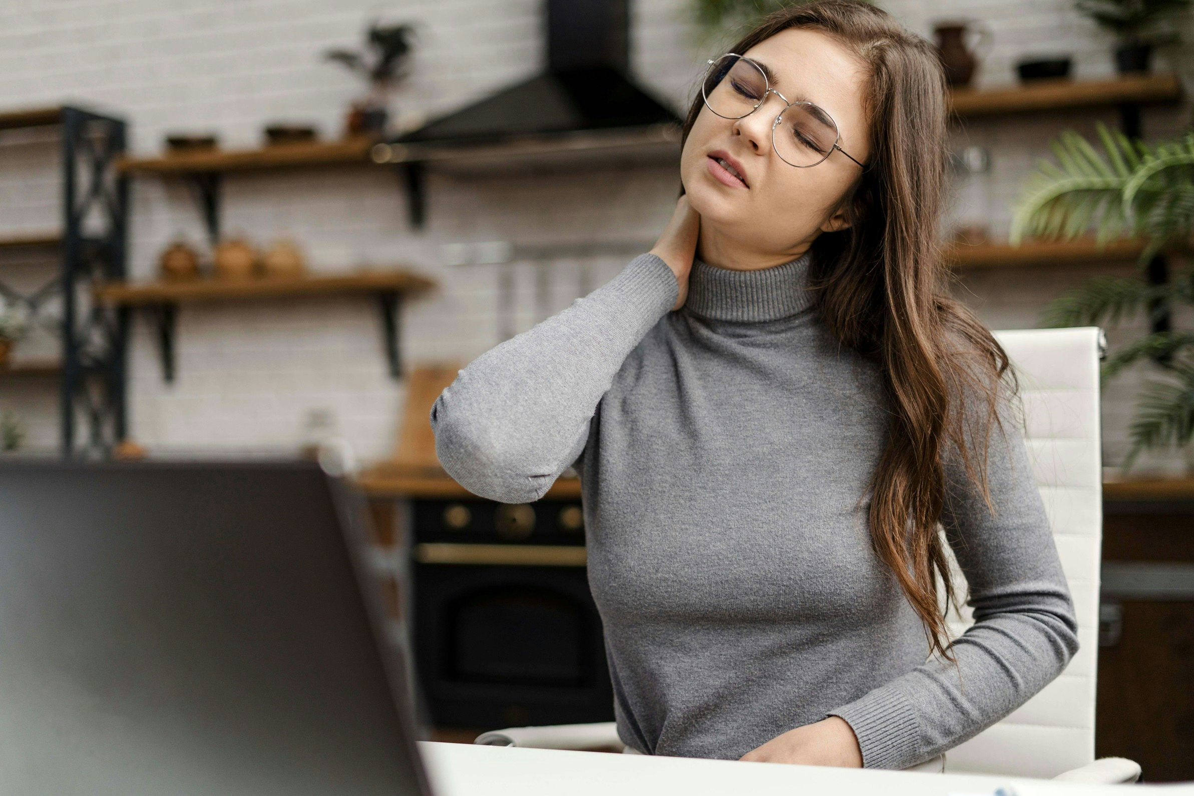 young-woman-having-neckache-while-working