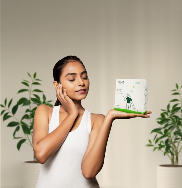Woman holding gummy Box
