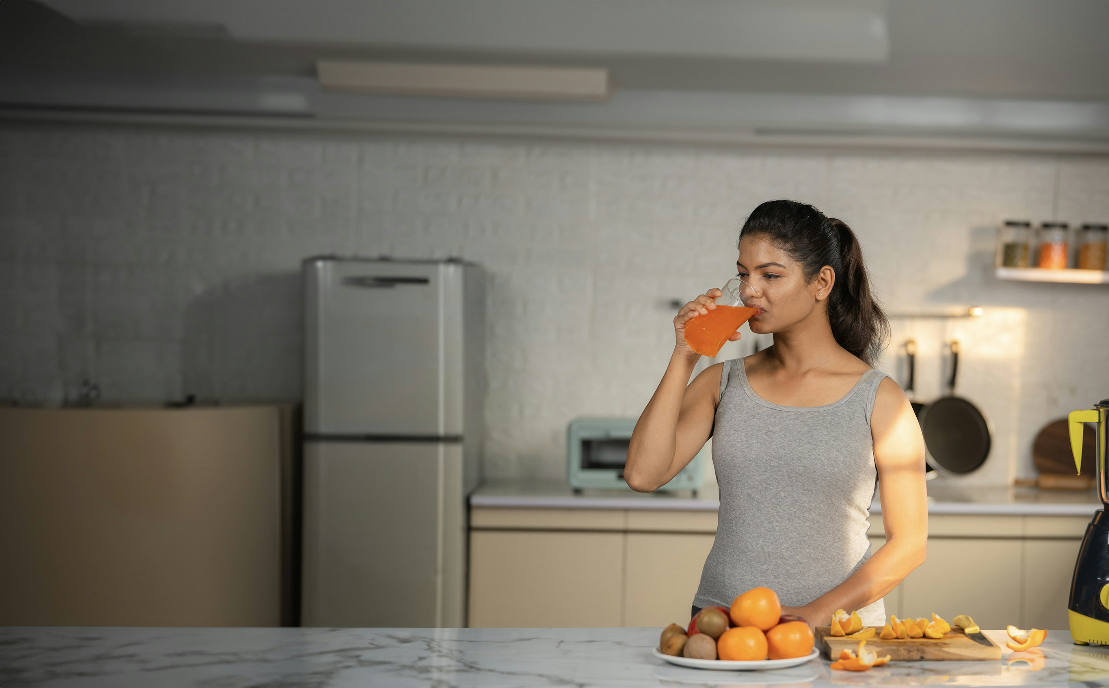 Women drinking Orange juice