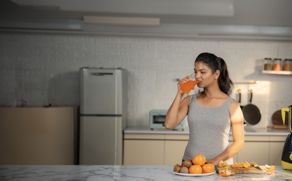 Women drinking Orange juice