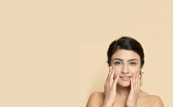 Smiling Woman Holding Face