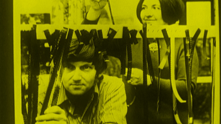 Two people looking at film strips