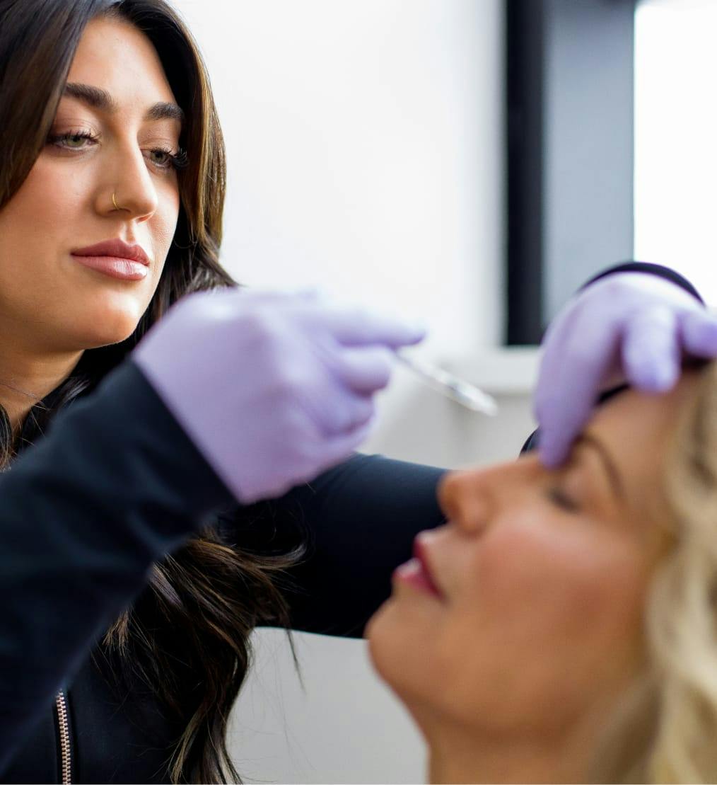 Woman getting an injectable cosmetic treatment.