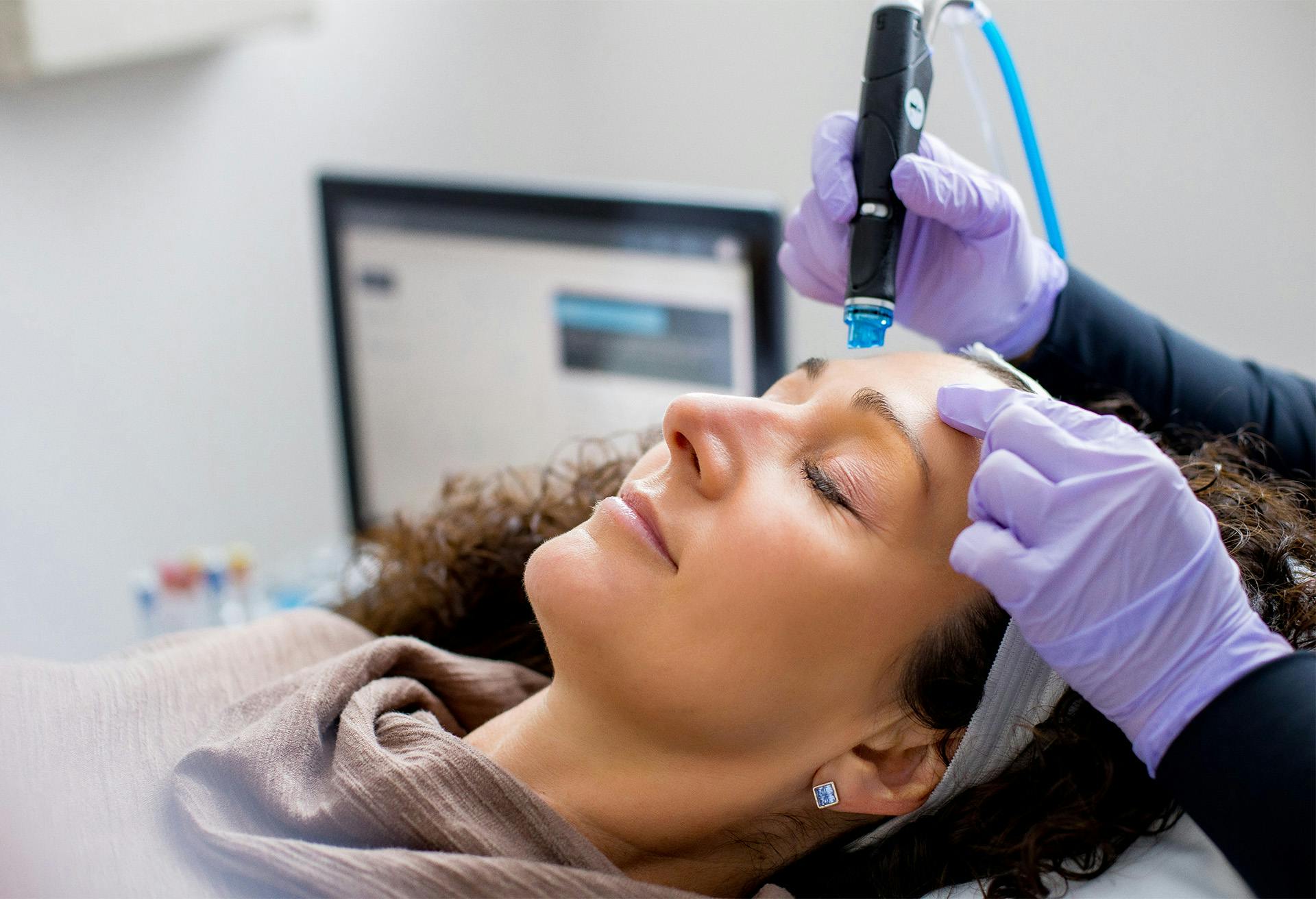 Woman receiving hydrafacial