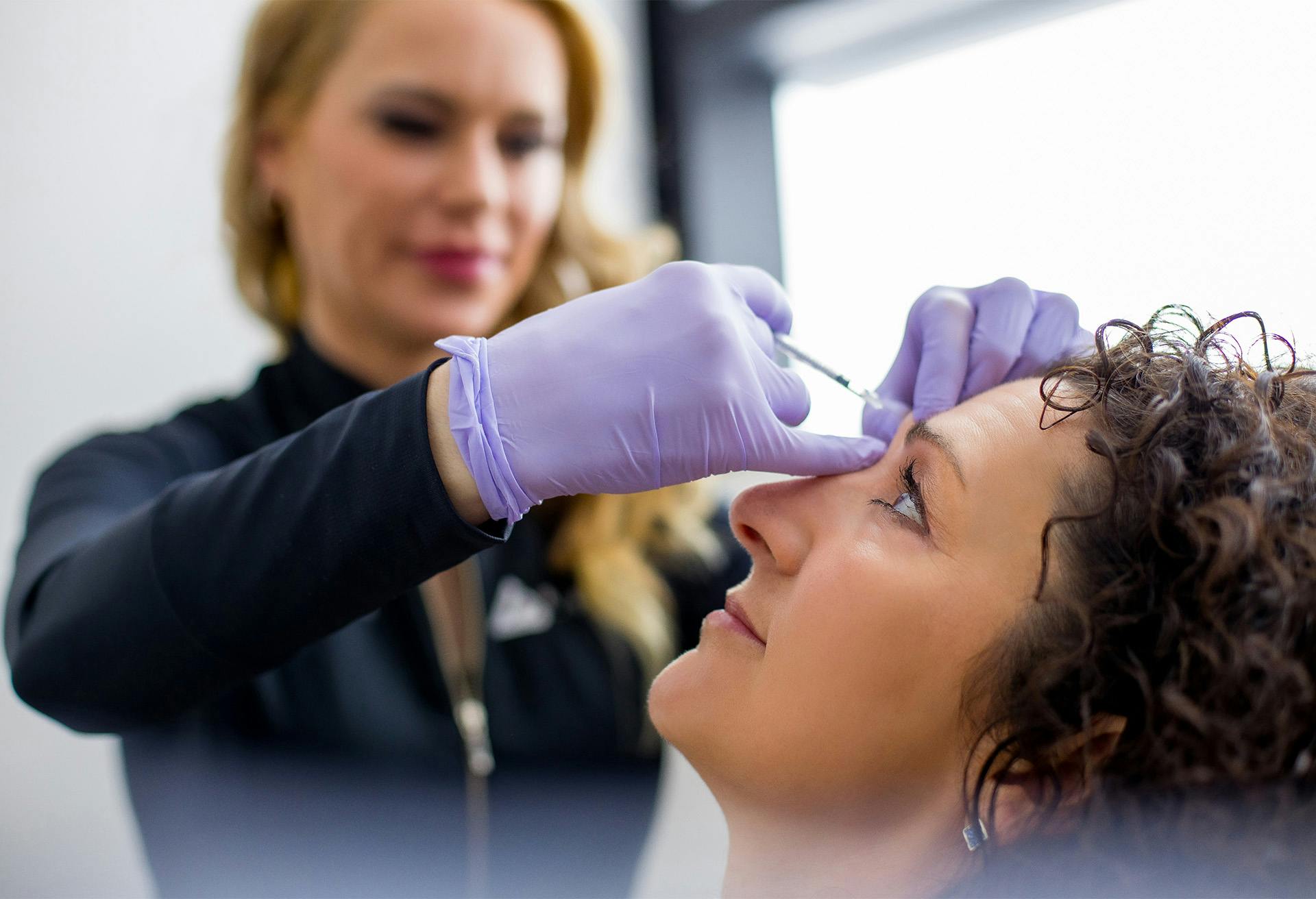 Woman receiving injectable treatment