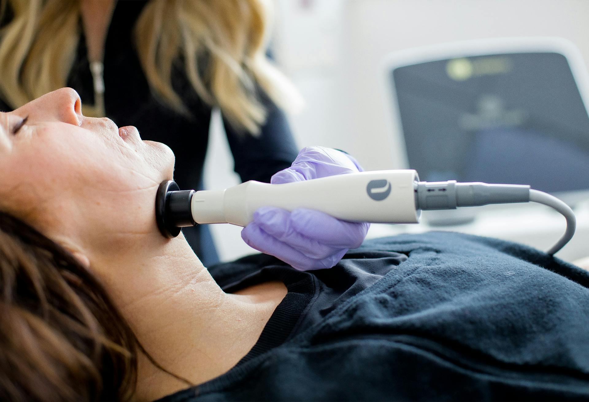 Woman receiving facial treatment