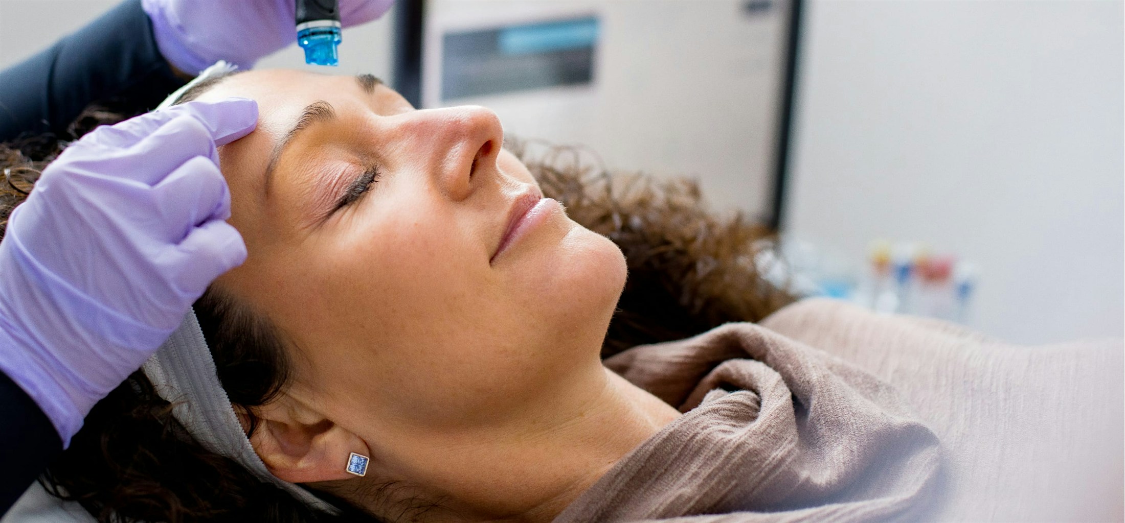 Woman receiving cosmetic laser treatment at Eleve Medspa.