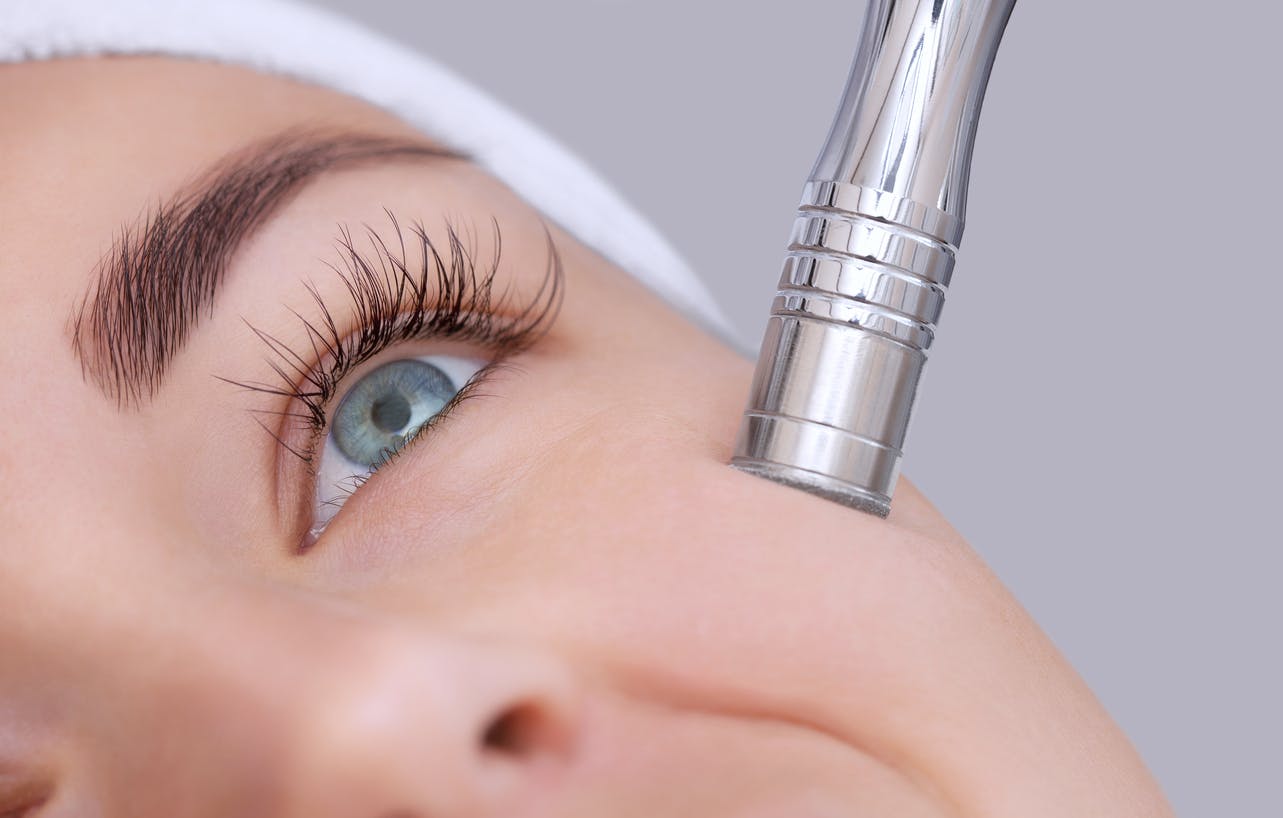 Woman receiving microdermabrasion