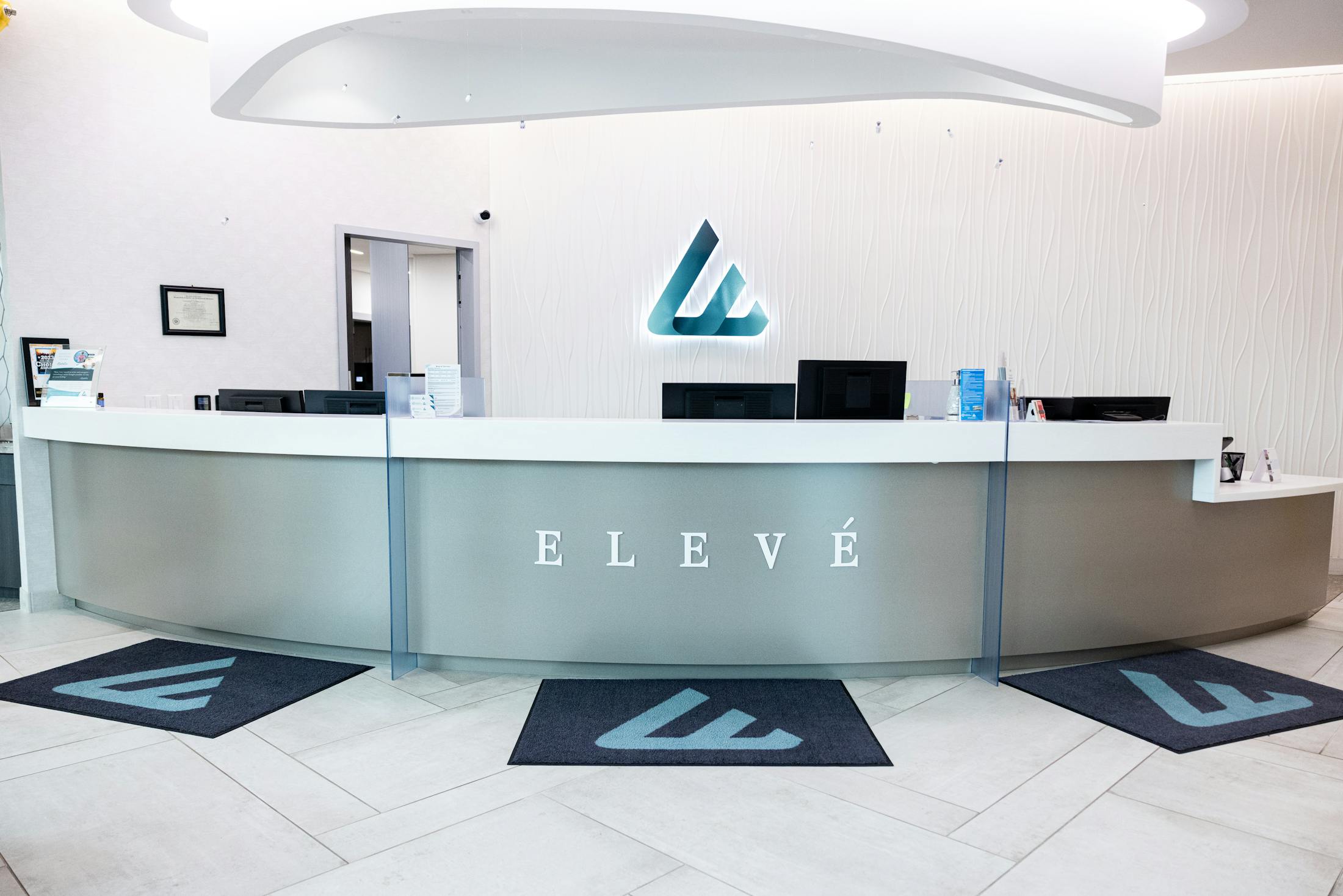 Front desk reception area of Eleve with curved desk