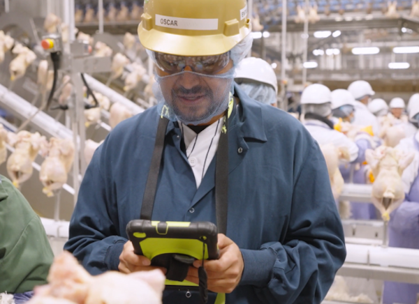 Supervisor using iPad to track product quality