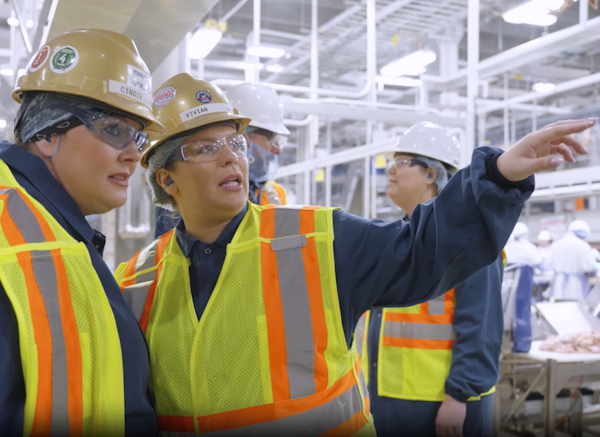 Two supervisors talking on the plant floor