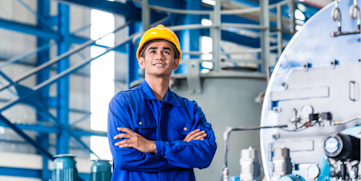 Happy manufacturing worker looking off into the distance