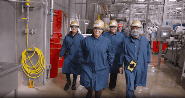 Quality managers and supervisors walk the shop floor