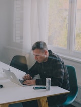 Person working on laptop inside office