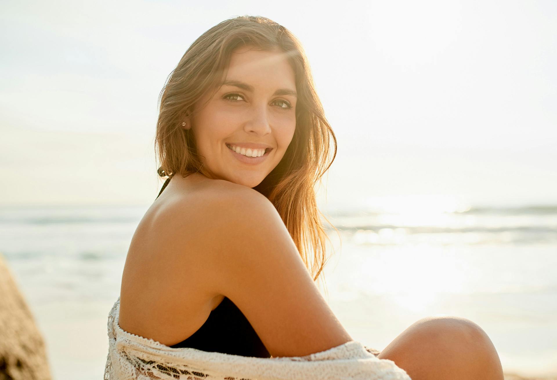 Woman smiling at the beach