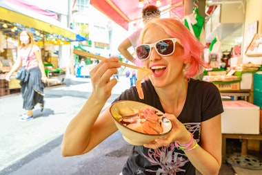 Woman Eating Sushi