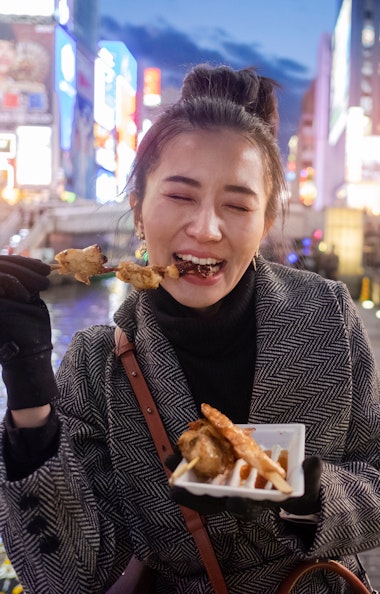 Woman Eating Kushikatsu Woman Eating Kushikatsu