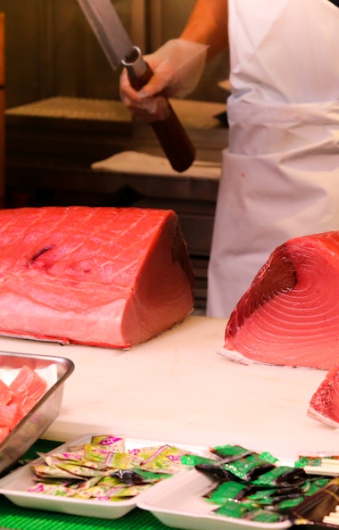 Man cutting fish Man cutting fish