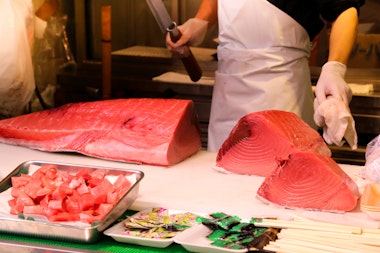 Man cutting fish