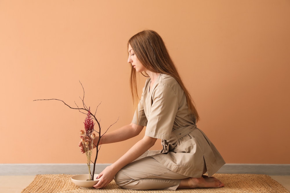 Woman arranging flowers