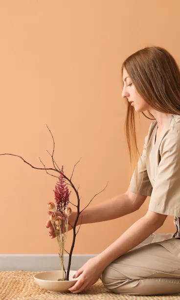 Woman arranging flowers Woman arranging flowers