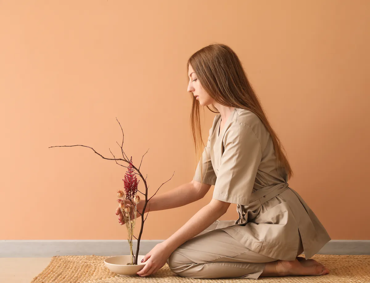 Woman arranging flowers Woman arranging flowers