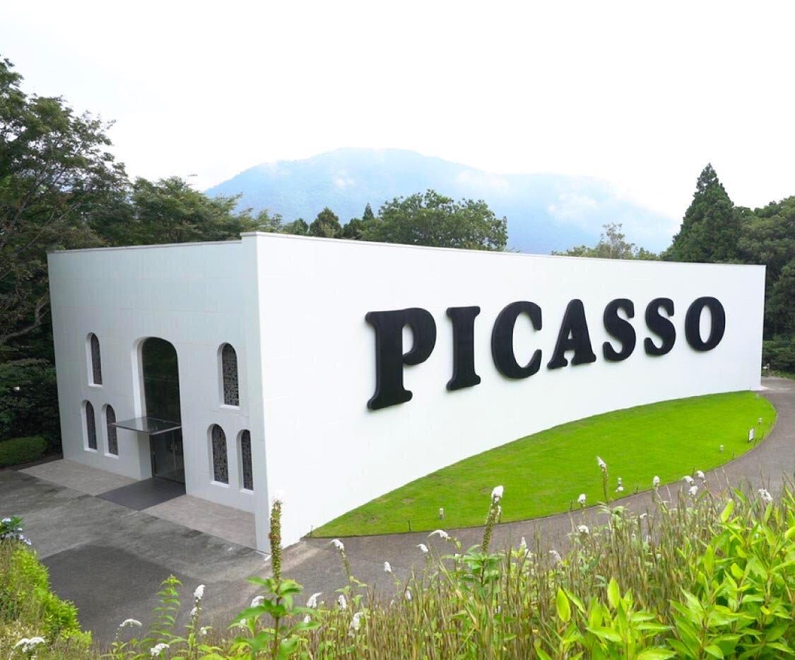 A white building with black letters on it.