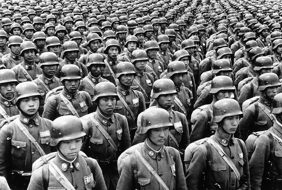 Japanese troops advancing during the early stages of World War II, showcasing Japan's initial territorial gains and victories.