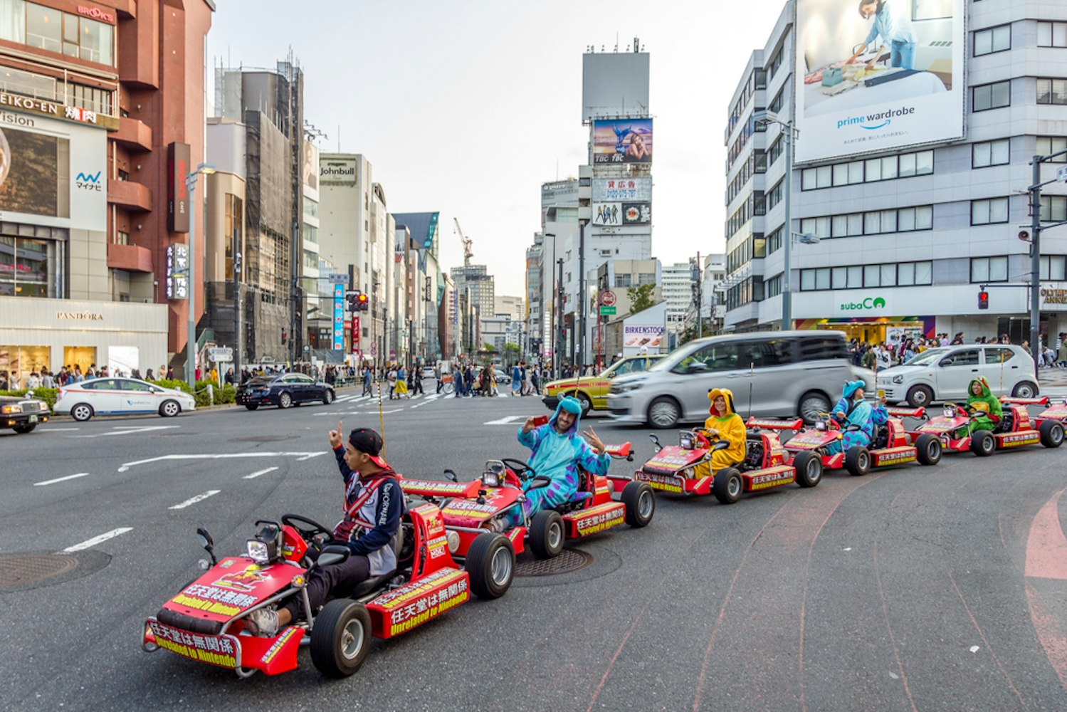 Cosplayers doing a kart tour in the city