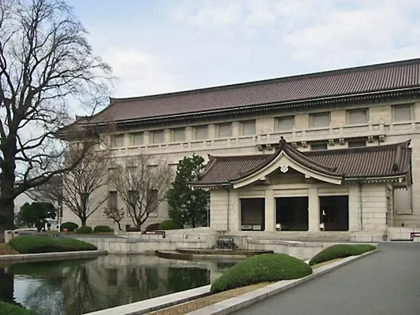 The Tokyo National Museum, a massive building with a pond in front.